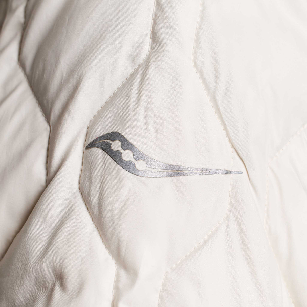 Saucony Solstice Oysterpuff manteau de course à pied femme logo réfléchissant- lin