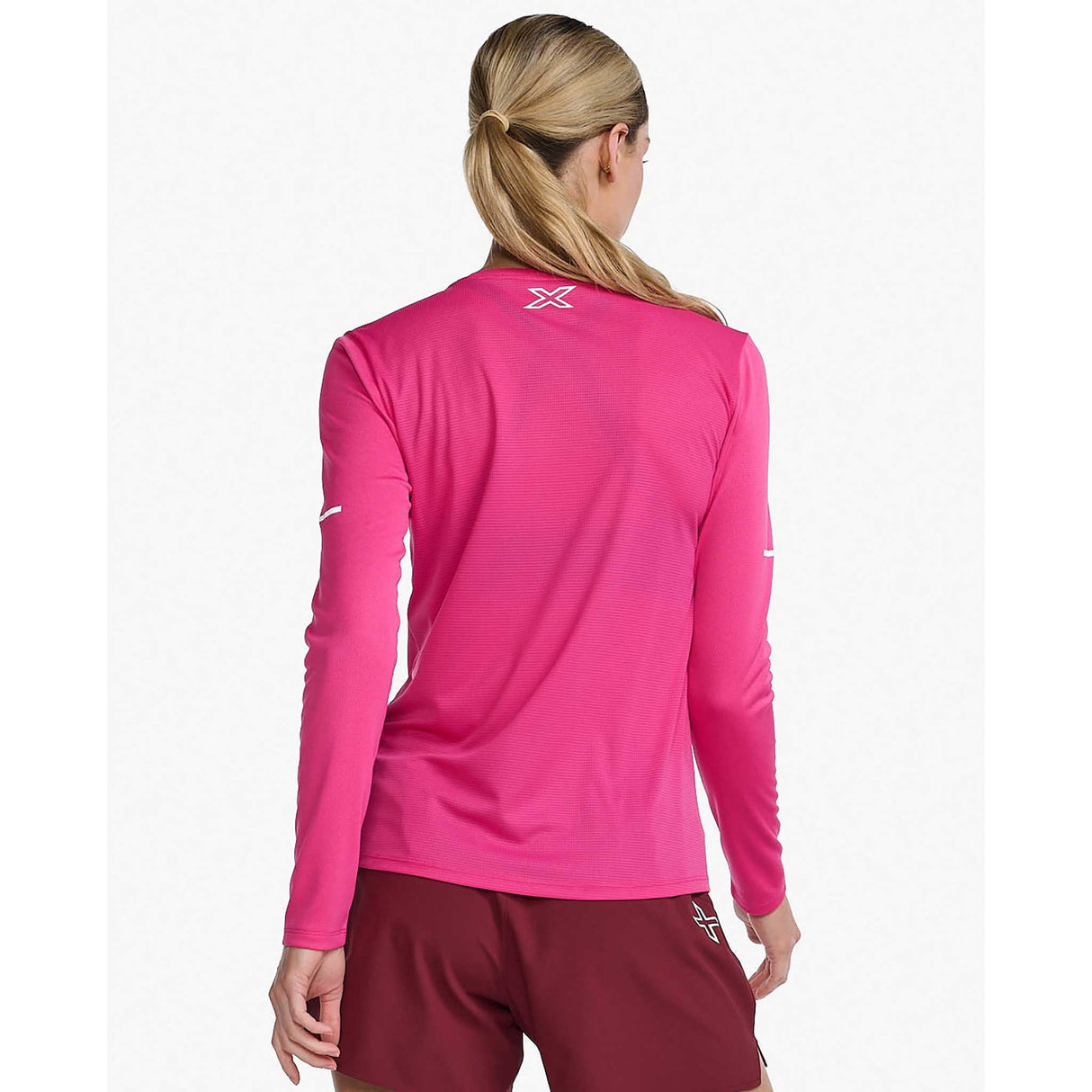 2XU Aero chandail à manches longues fuchsia blanc réfléchissant femme dos