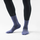 Smartwool Glow women's merino wool running crew sock in dusk blue, worn with running tights