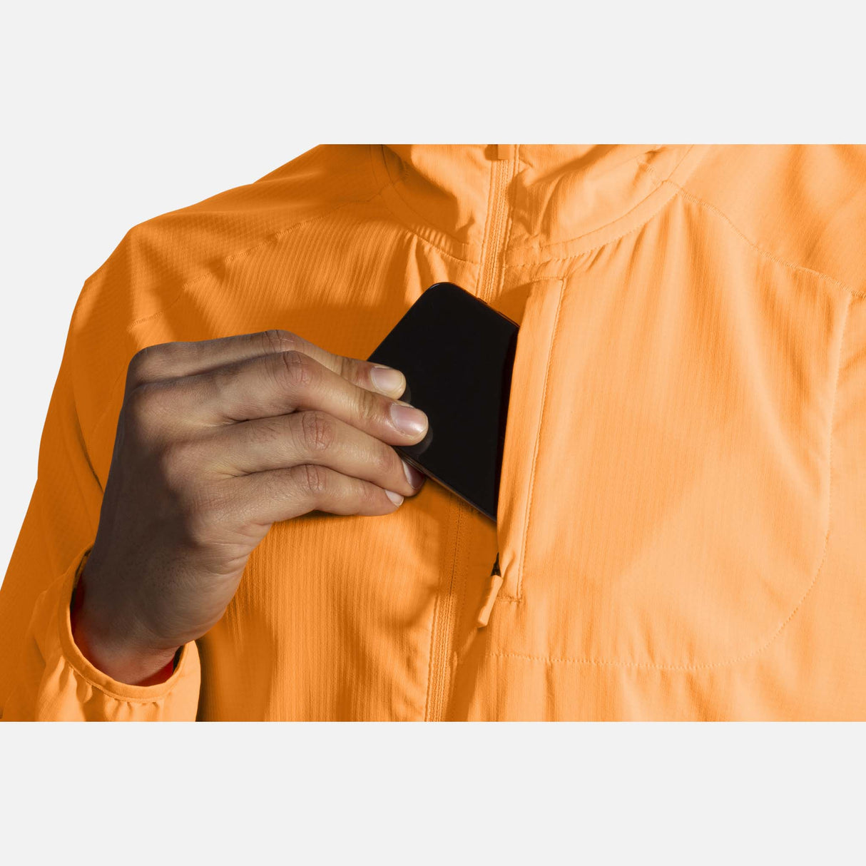 Brooks Canopy Jacket de course orange fluo homme pochette avant